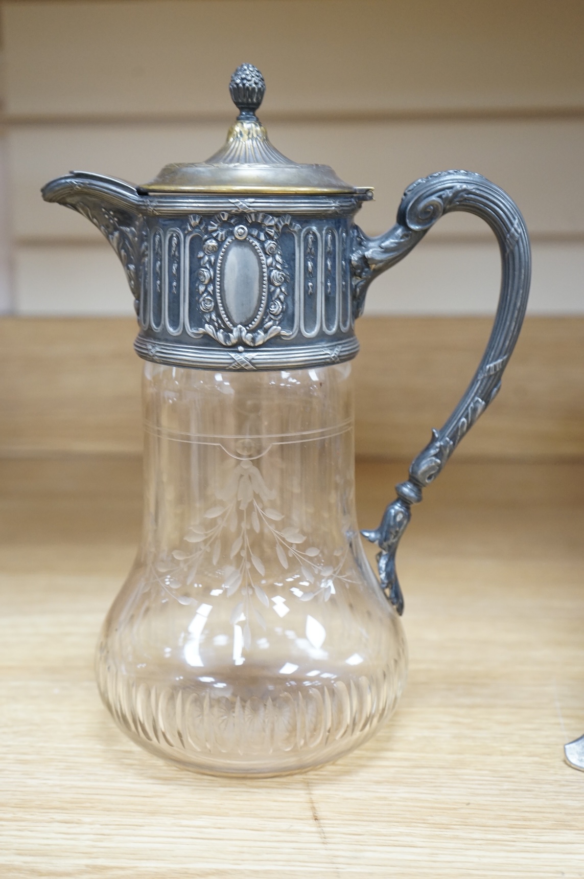 A WMF style metal mounted and engraved glass claret jug and a later figural easel mirror, tallest mirror 36cm.